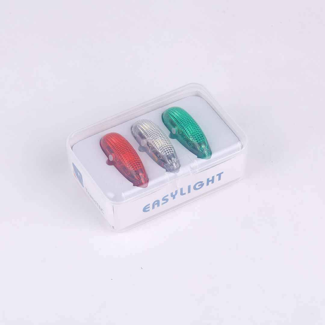 Red, silver, green aviation lights in clear packaging