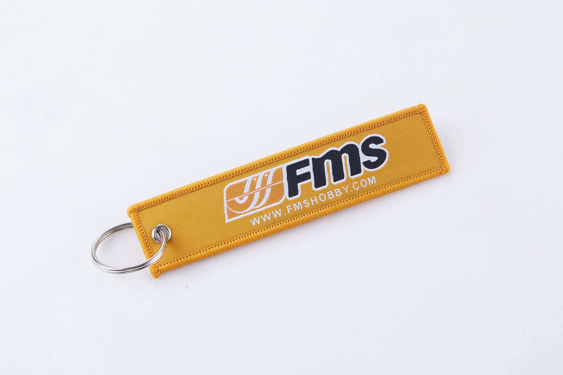 Yellow FMS keychain with logo for RC model enthusiasts