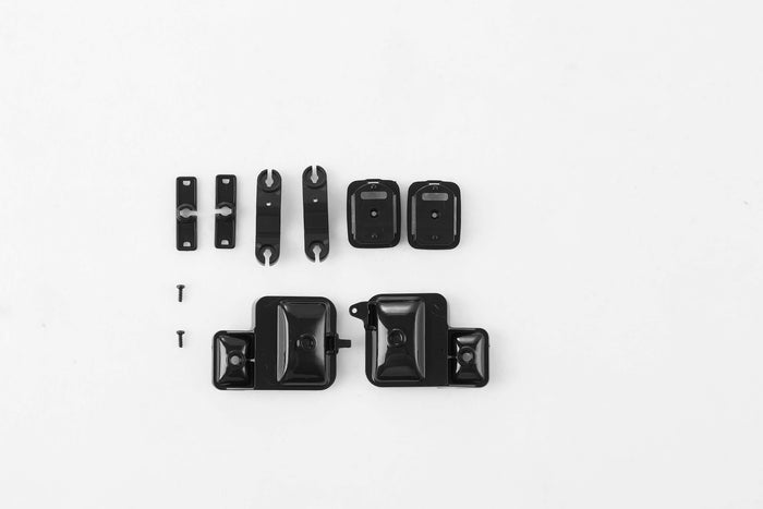 Black RC model accessories including clips, mounts, and screws